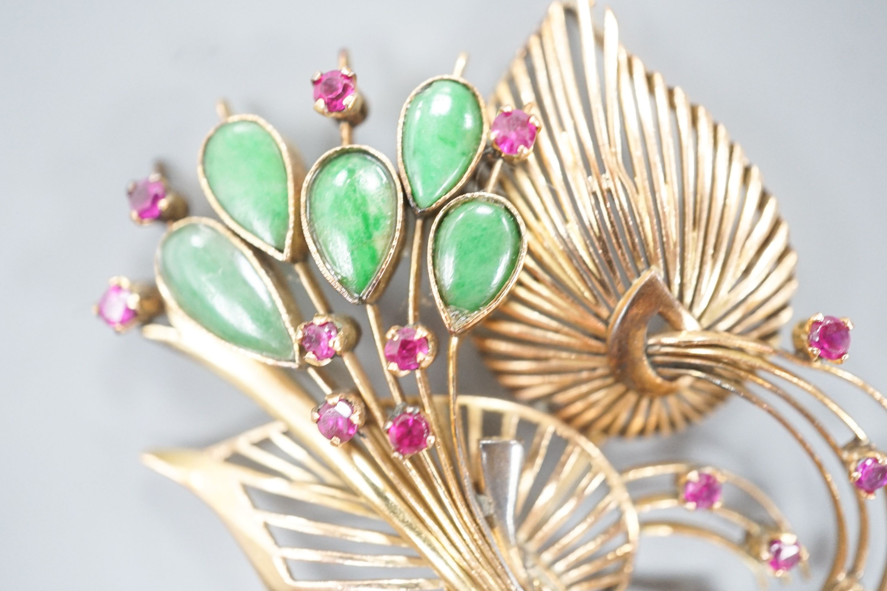 A yellow metal, jade and gem set floral spray brooch, 53mm, gross weight 13.9 grams.